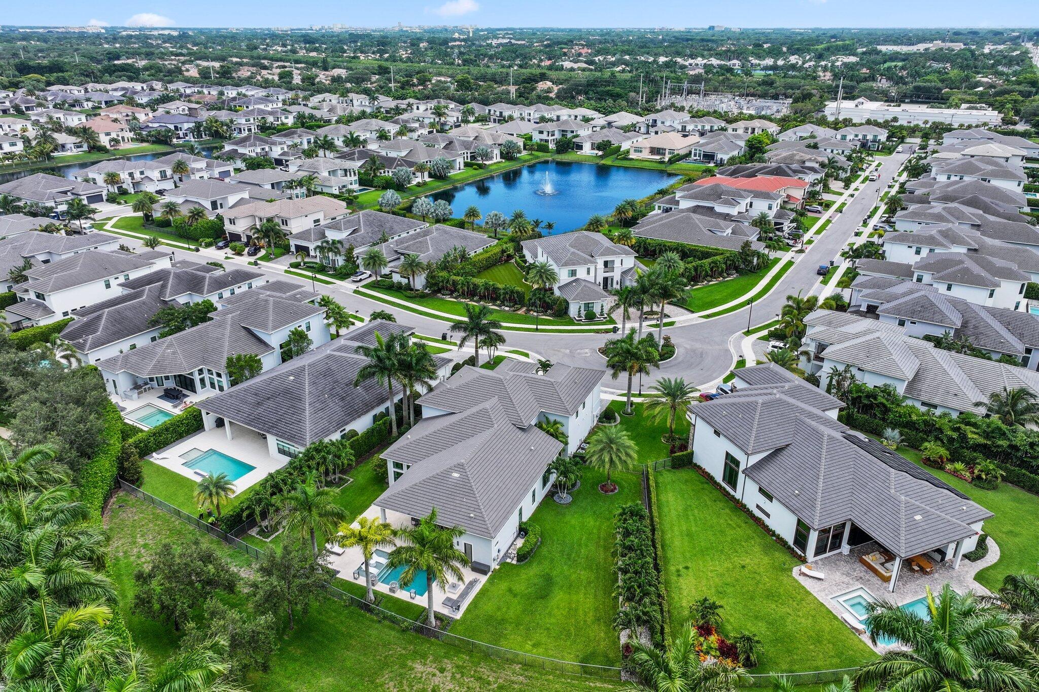 2741 Northwest 70th Boulevard Boca Raton, FL 33496 - Photo 82 of 109 an aerial view of residential houses with outdoor space and river