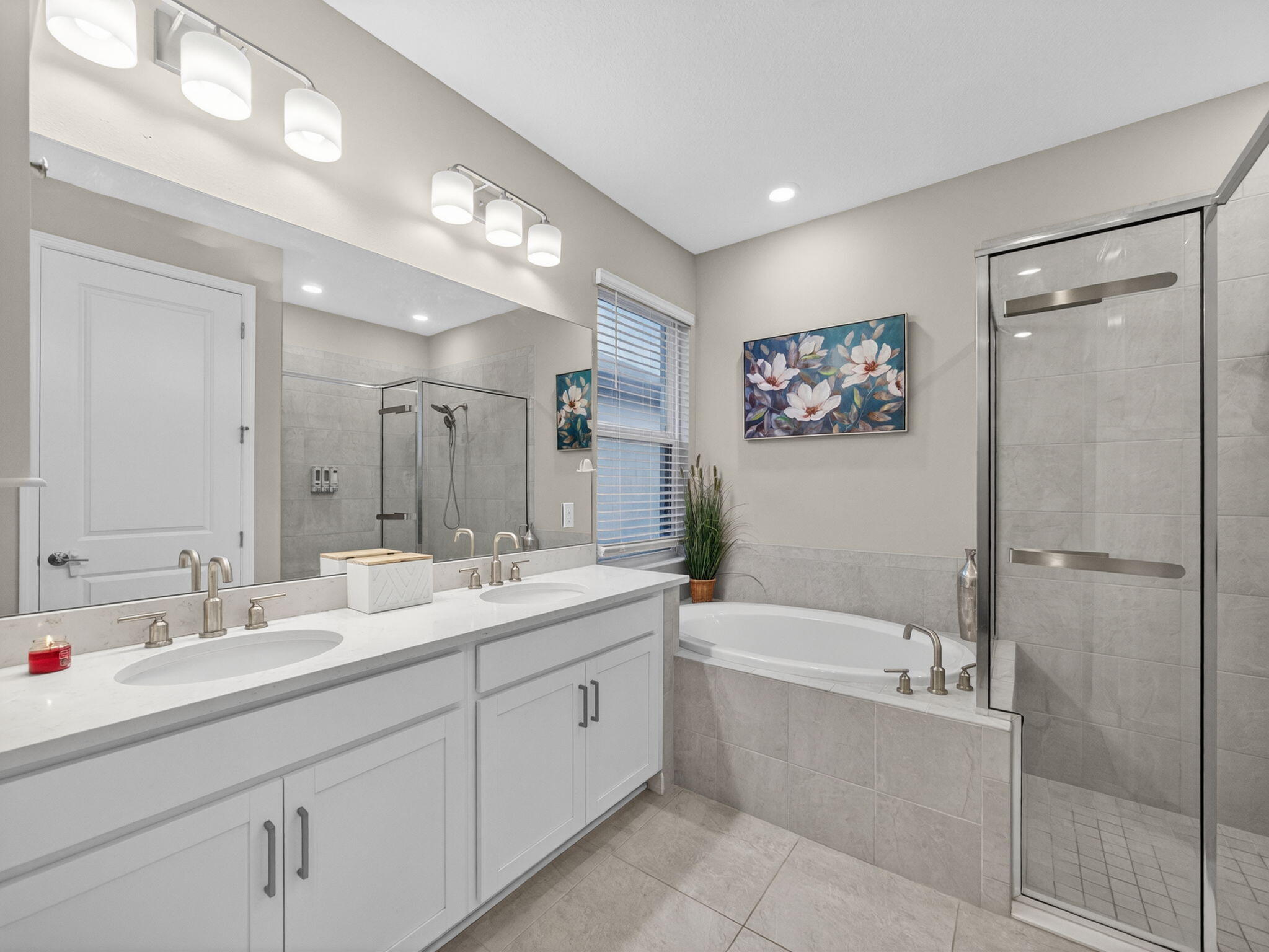 11912 Southwest Macelli Way Port Port St. Lucie, FL 34987 - Photo 11 of 34 a bathroom with a double vanity sink mirror double and bathtub