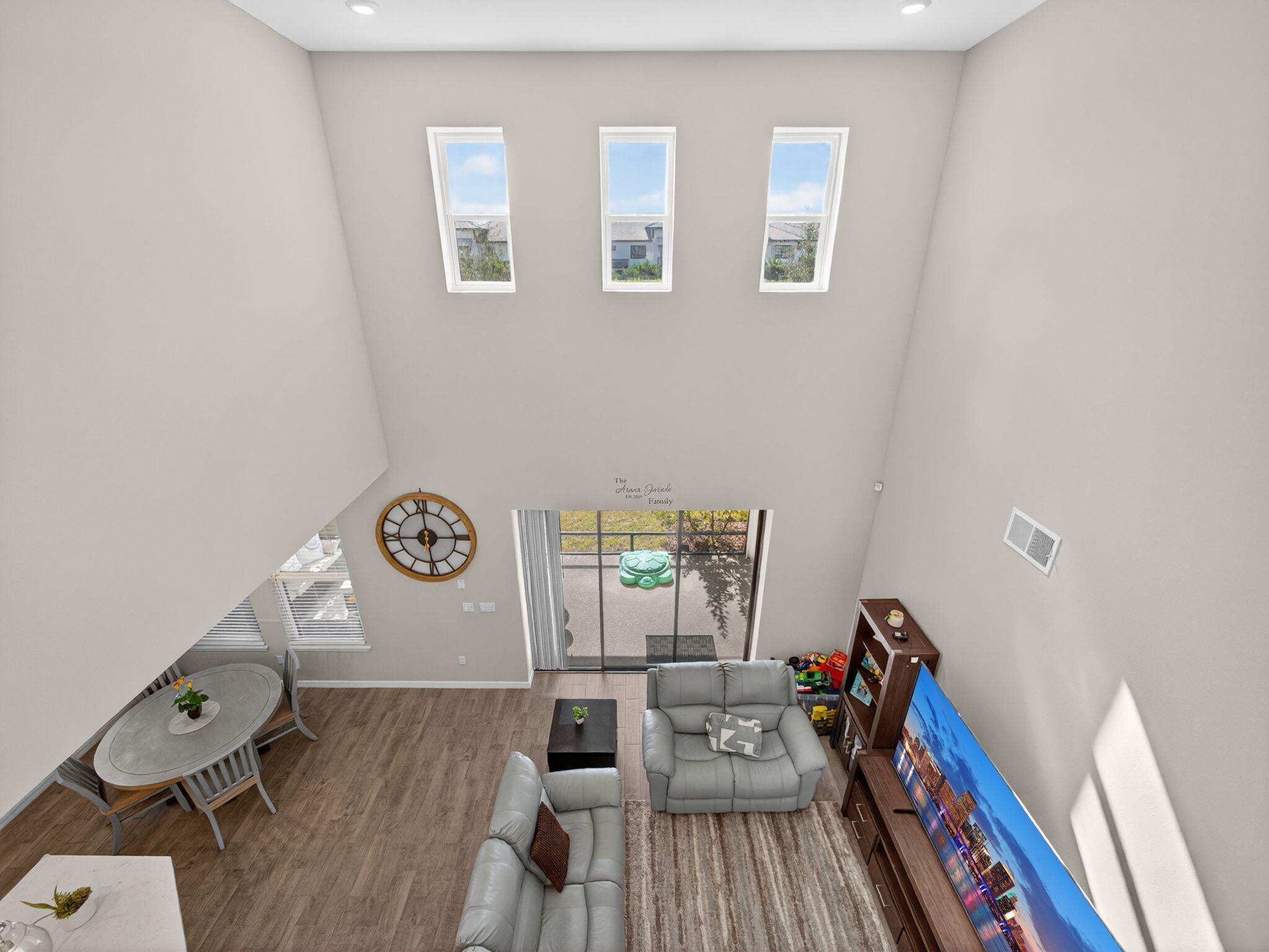 11912 Southwest Macelli Way Port Port St. Lucie, FL 34987 - Photo 15 of 34 a view of a livingroom with lounge chair and wooden floor