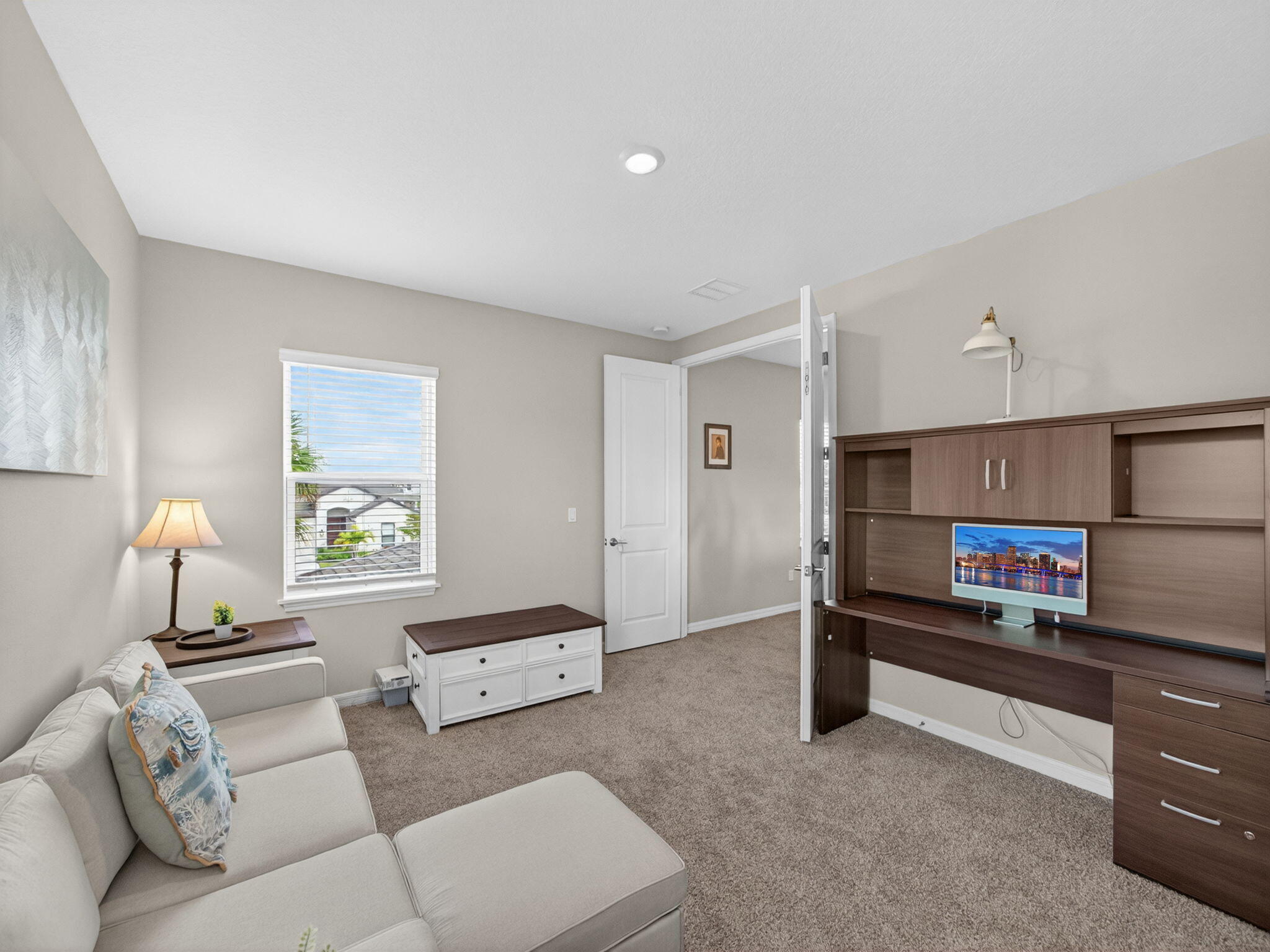 11912 Southwest Macelli Way Port Port St. Lucie, FL 34987 - Photo 17 of 34 a living room with furniture and a window