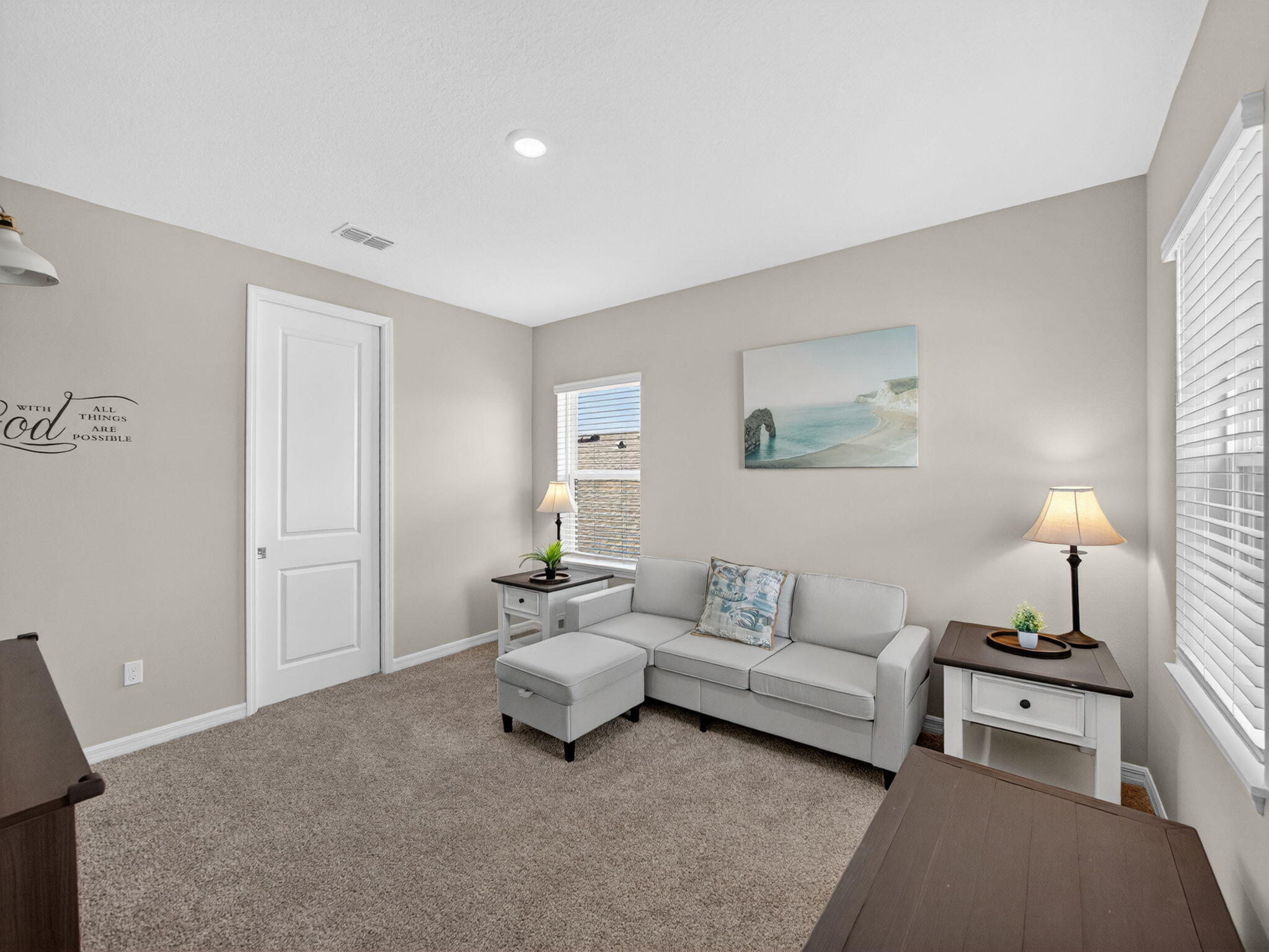 11912 Southwest Macelli Way Port Port St. Lucie, FL 34987 - Photo 18 of 34 a living room with furniture and a lamp