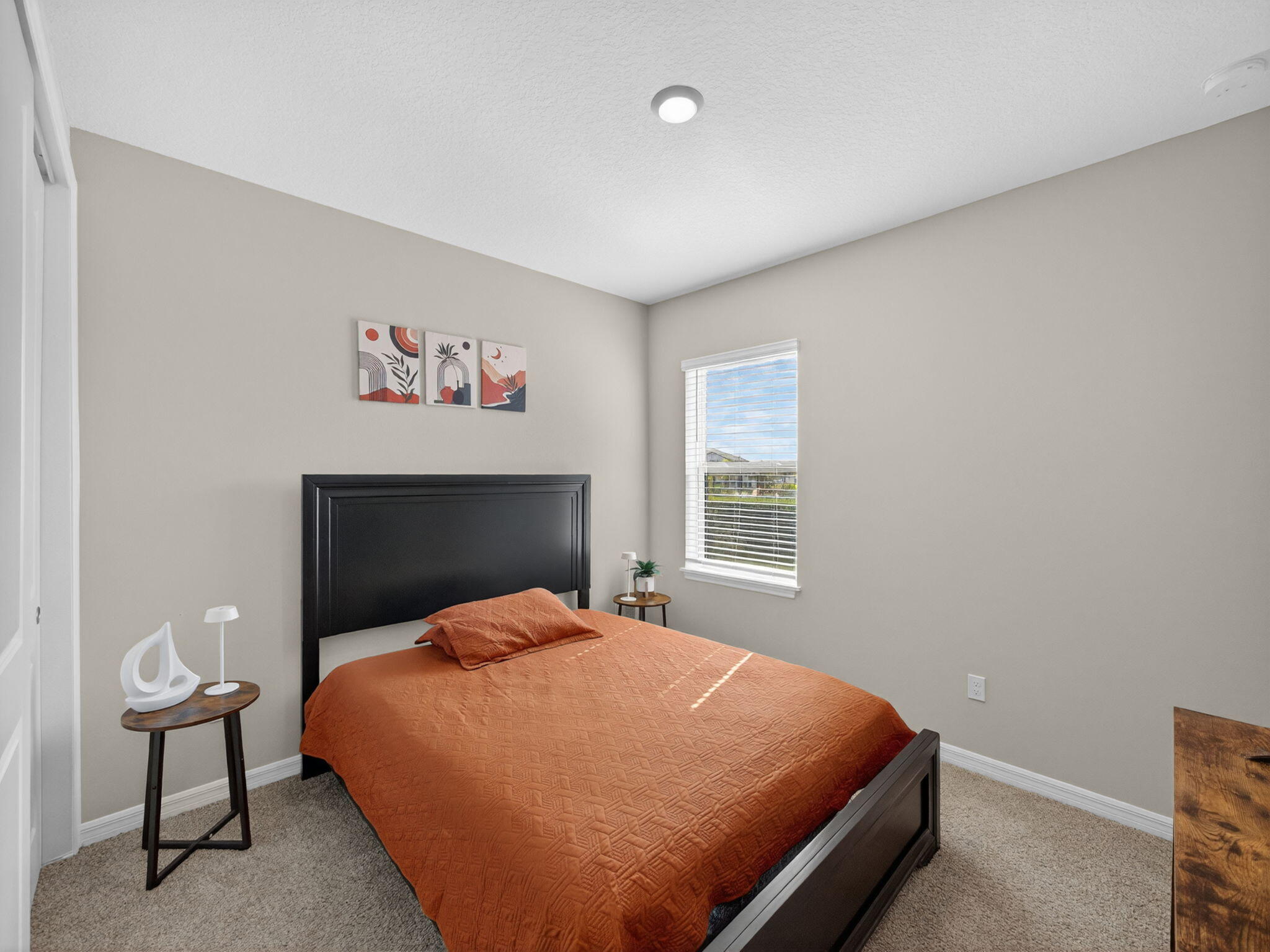 11912 Southwest Macelli Way Port Port St. Lucie, FL 34987 - Photo 22 of 34 a bedroom with a bed and chair