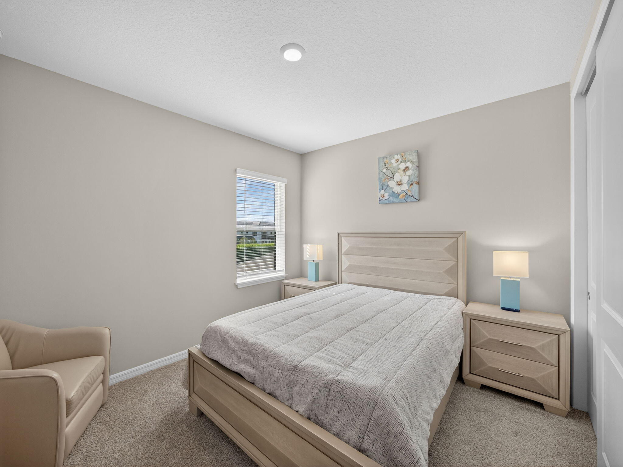 11912 Southwest Macelli Way Port Port St. Lucie, FL 34987 - Photo 24 of 34 a bedroom with a bed and a couch