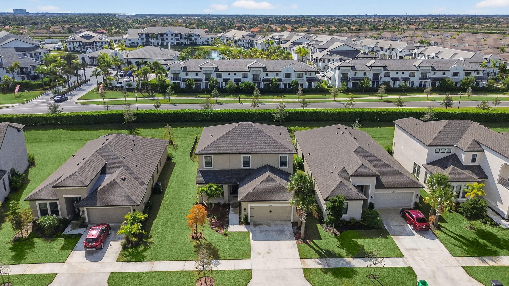 11912 Southwest Macelli Way Port Port St. Lucie, FL 34987 - Photo 32 of 34 an aerial view of a house with a garden and lake view