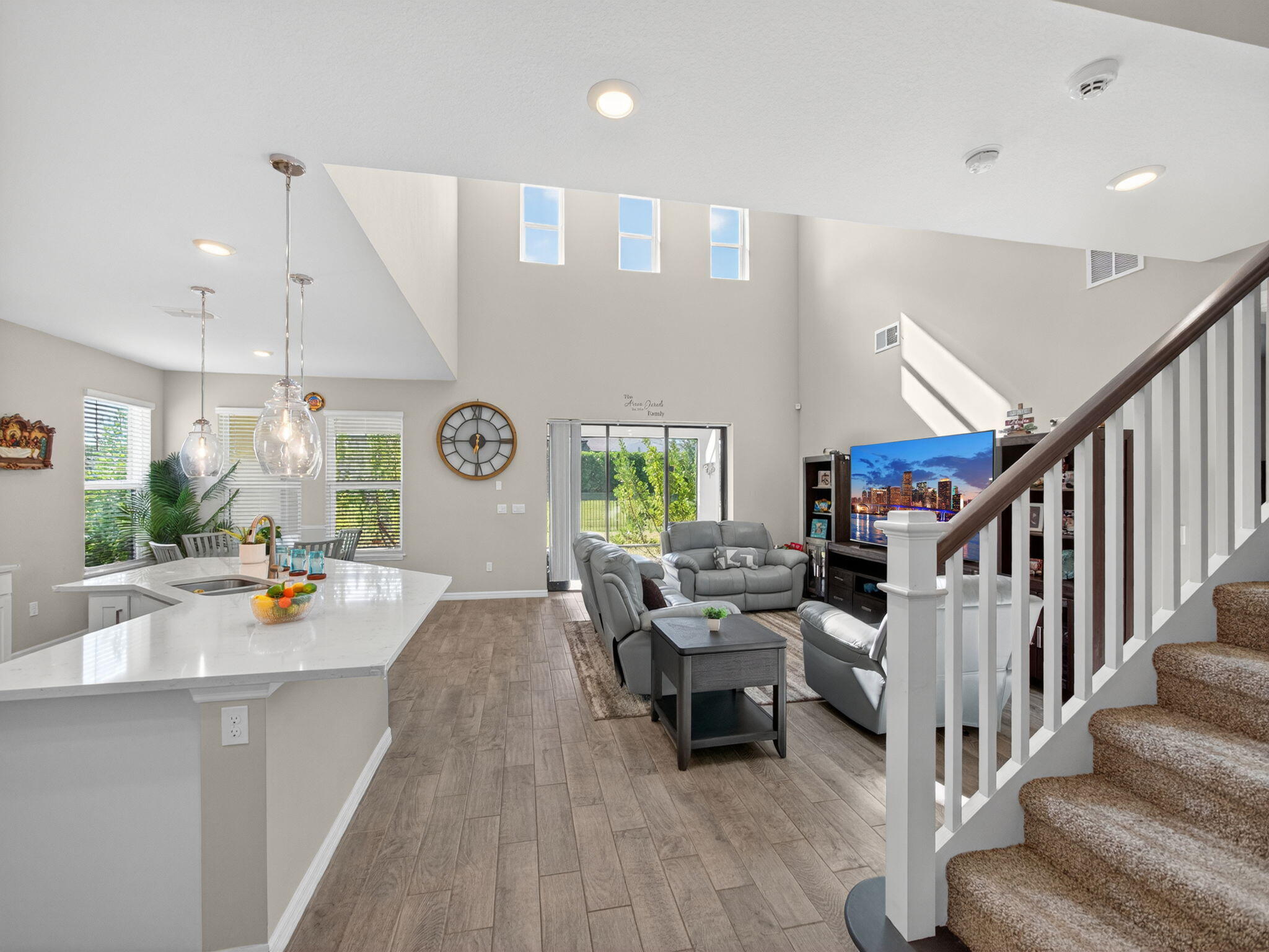 11912 Southwest Macelli Way Port Port St. Lucie, FL 34987 - Photo 5 of 34 a living room with furniture and a large window