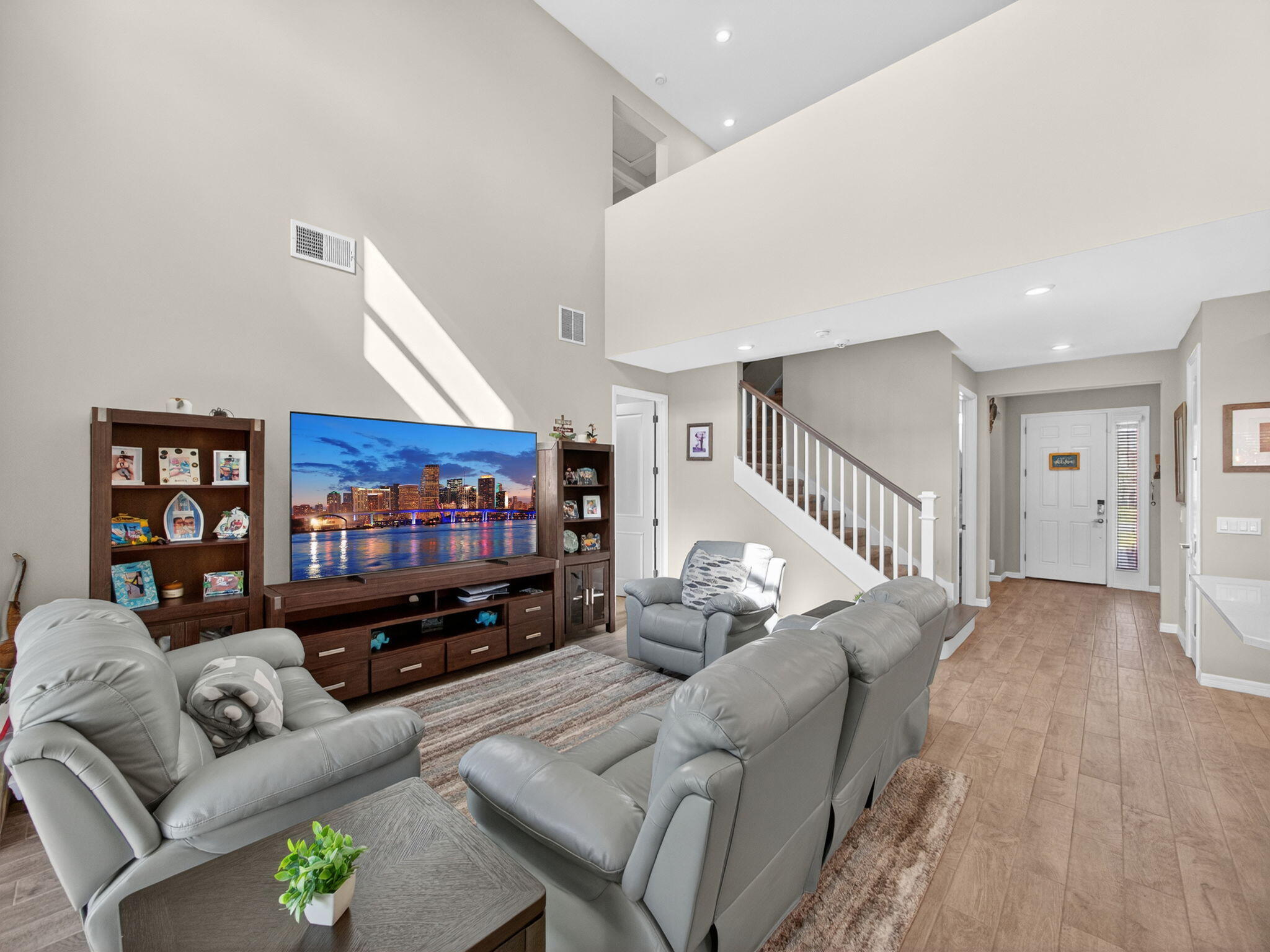 11912 Southwest Macelli Way Port Port St. Lucie, FL 34987 - Photo 6 of 34 a living room with furniture and a flat screen tv