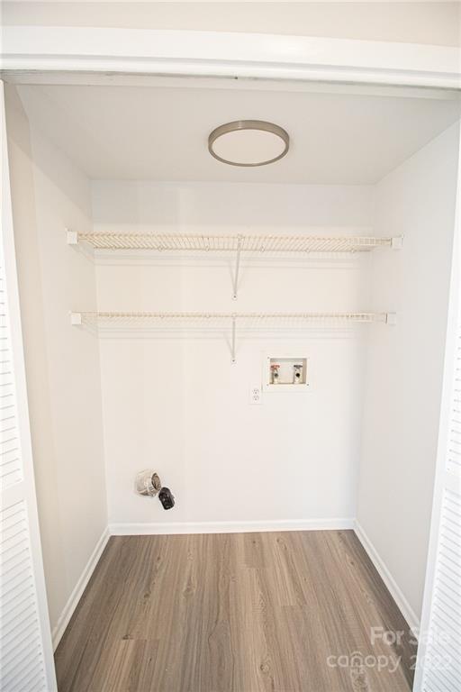 11039 Cedar View Road Charlotte, NC 28226 - Photo 13 of 24 a view of a closet with wooden floor