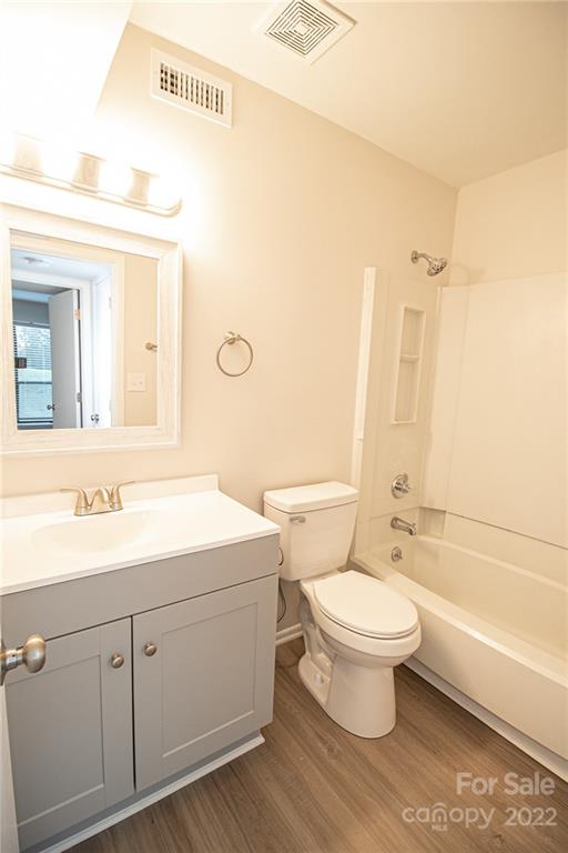 11039 Cedar View Road Charlotte, NC 28226 - Photo 15 of 24 a bathroom with a double vanity sink toilet mirror and bathtub
