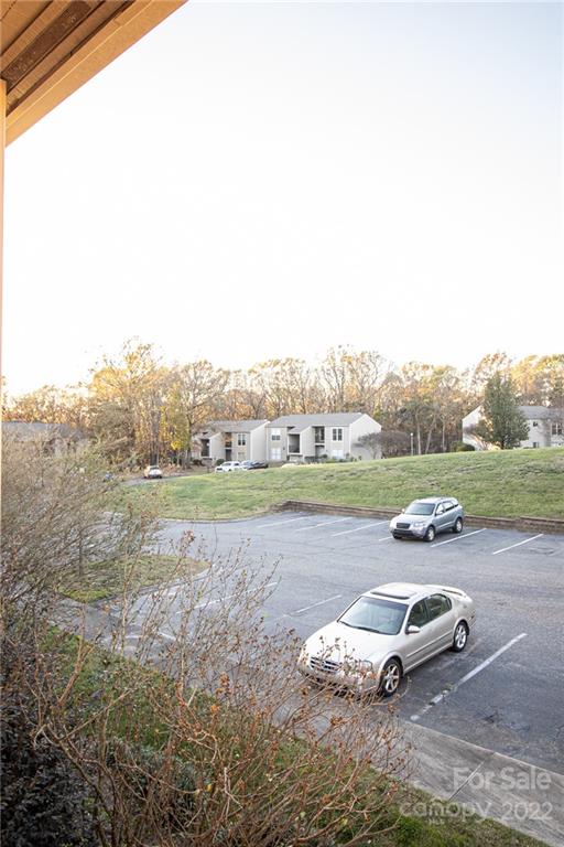 11039 Cedar View Road Charlotte, NC 28226 - Photo 2 of 24 a car parked in the middle of a field