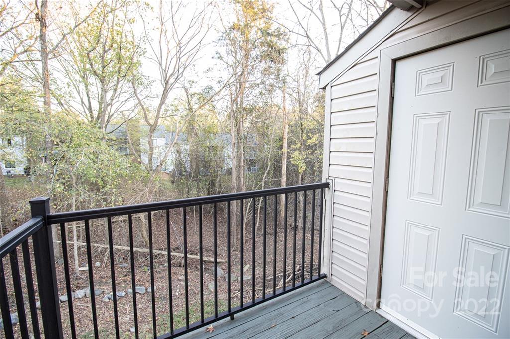 11039 Cedar View Road Charlotte, NC 28226 - Photo 24 of 24 a view of a balcony with wooden floor and fence