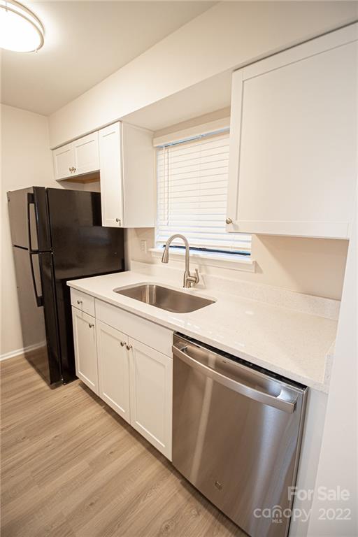 11039 Cedar View Road Charlotte, NC 28226 - Photo 9 of 24 a kitchen with stainless steel appliances a refrigerator sink and microwave