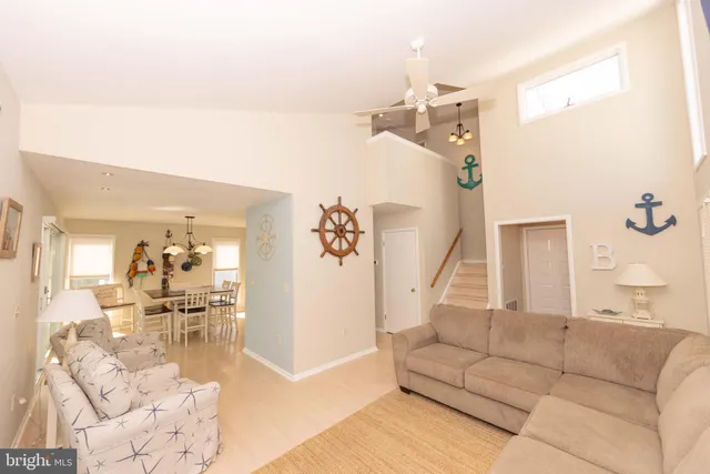 a view of a dining room and livingroom with furniture