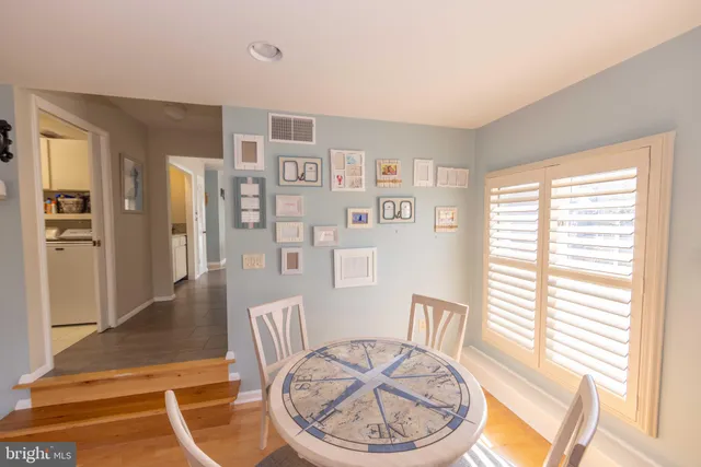 a bedroom with a bed and a dresser in it
