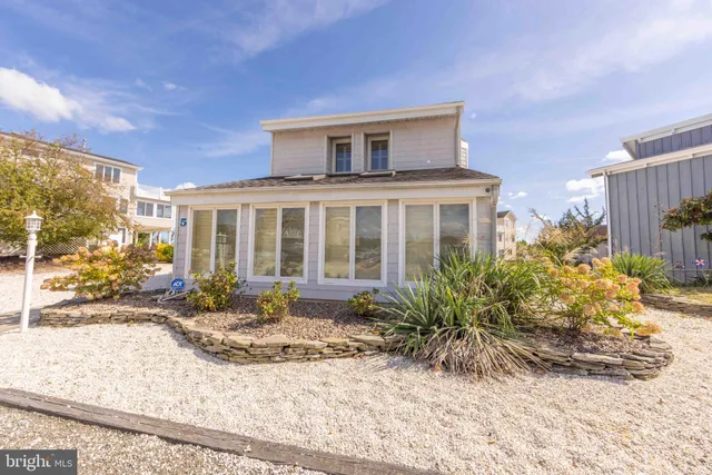 front view of a brick house with a outdoor space