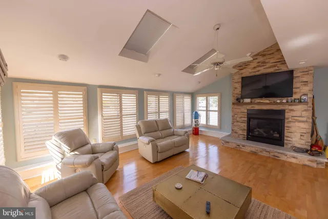 a bedroom with two beds and a window