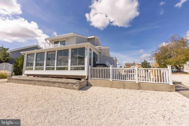 a view of a balcony with outdoor seating