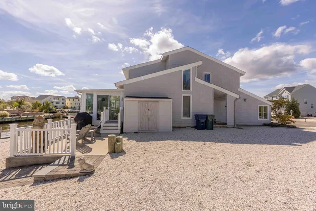 a view of a house with a bench