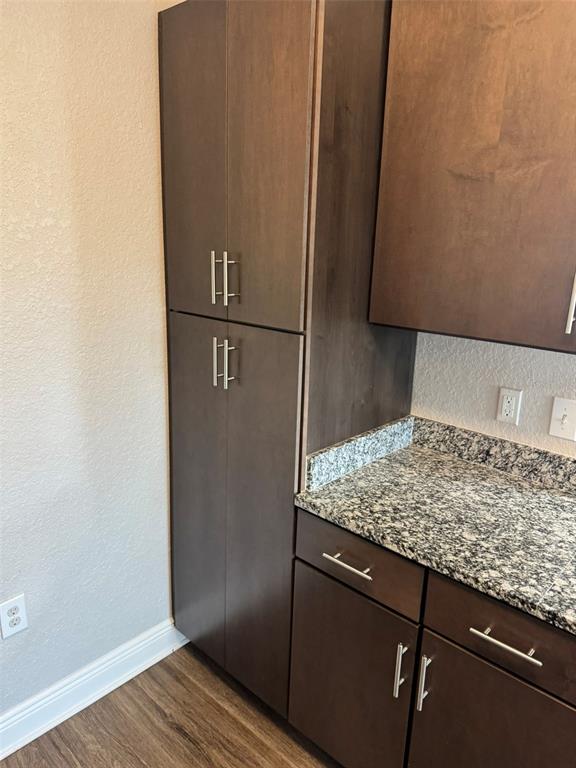 2420 Ann Rou Road, Unit 201 Tavares, FL 32778 - Photo 13 of 25 a kitchen with a wooden floor and a refrigerator