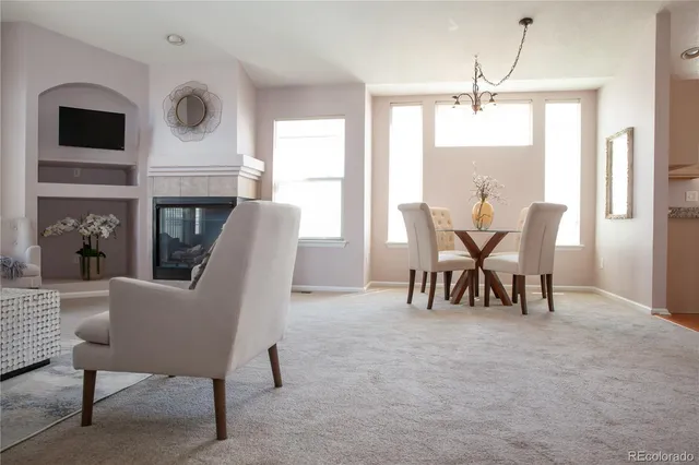 a view of a livingroom with furniture and a window