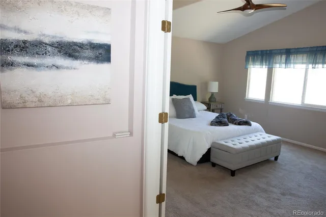 a bedroom with a bed and a window in it