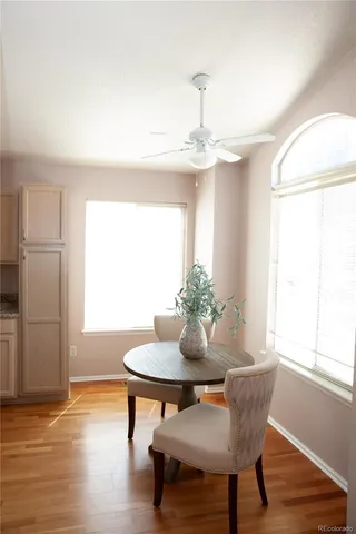 a dining room with furniture and window