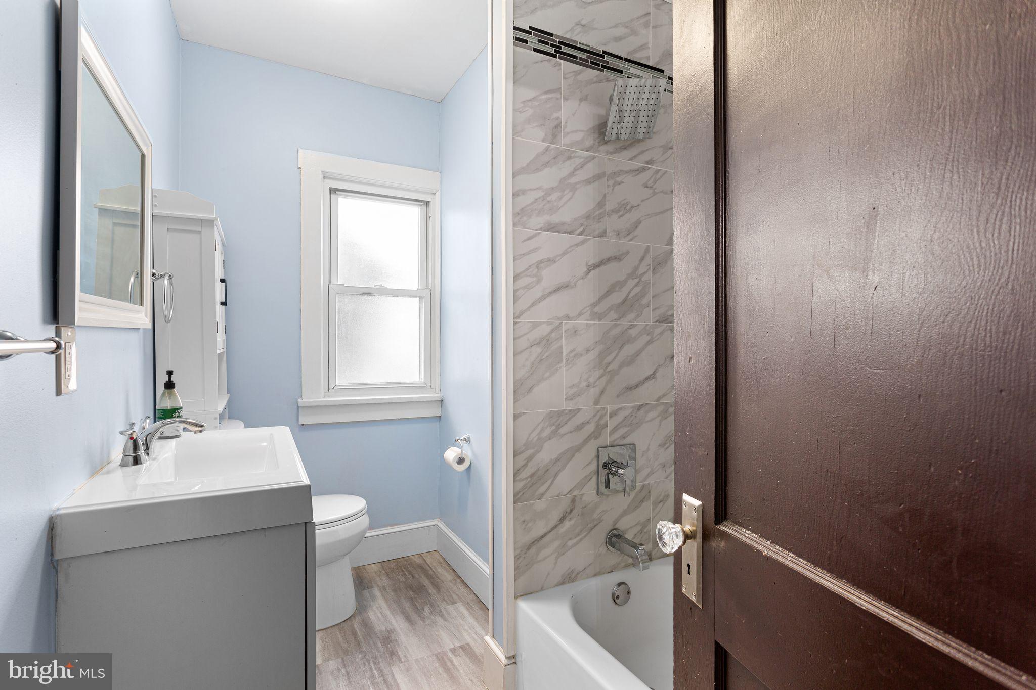 216 Richey Avenue Collingswood, NJ 08107 - Photo 13 of 39 a bathroom with a sink a toilet and shower