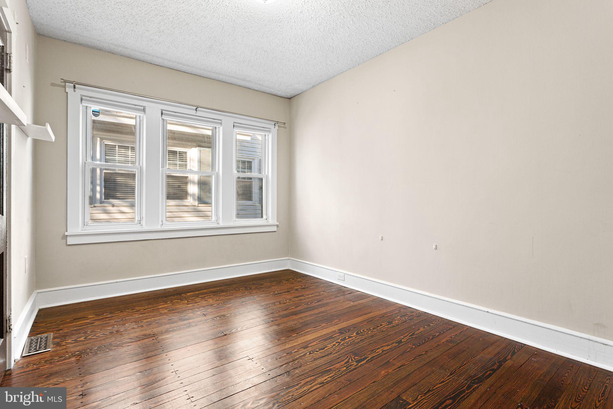 216 Richey Avenue Collingswood, NJ 08107 - Photo 14 of 39 a view of empty room with wooden floor and fan