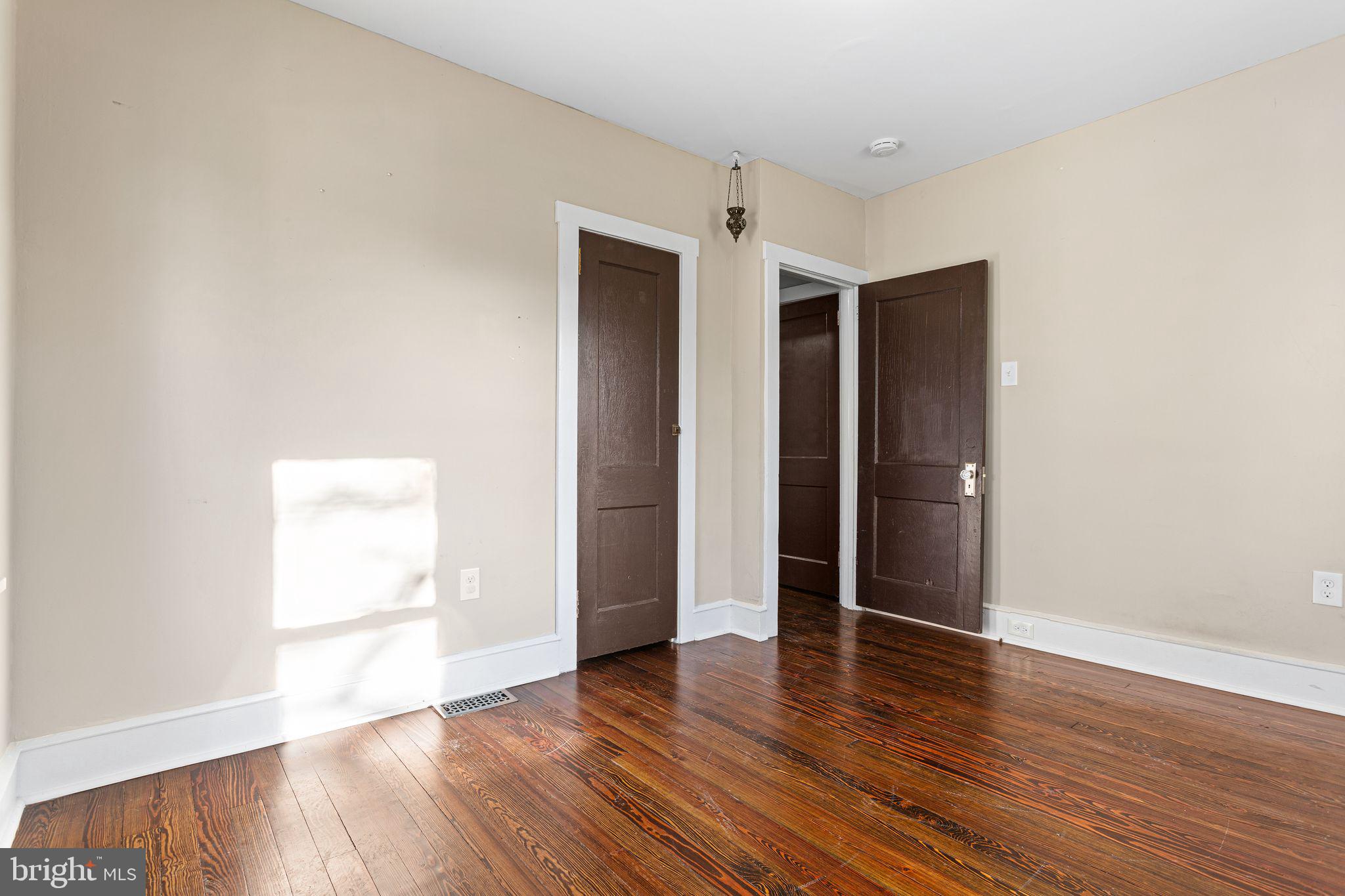 216 Richey Avenue Collingswood, NJ 08107 - Photo 17 of 39 an empty room with wooden floor & windows