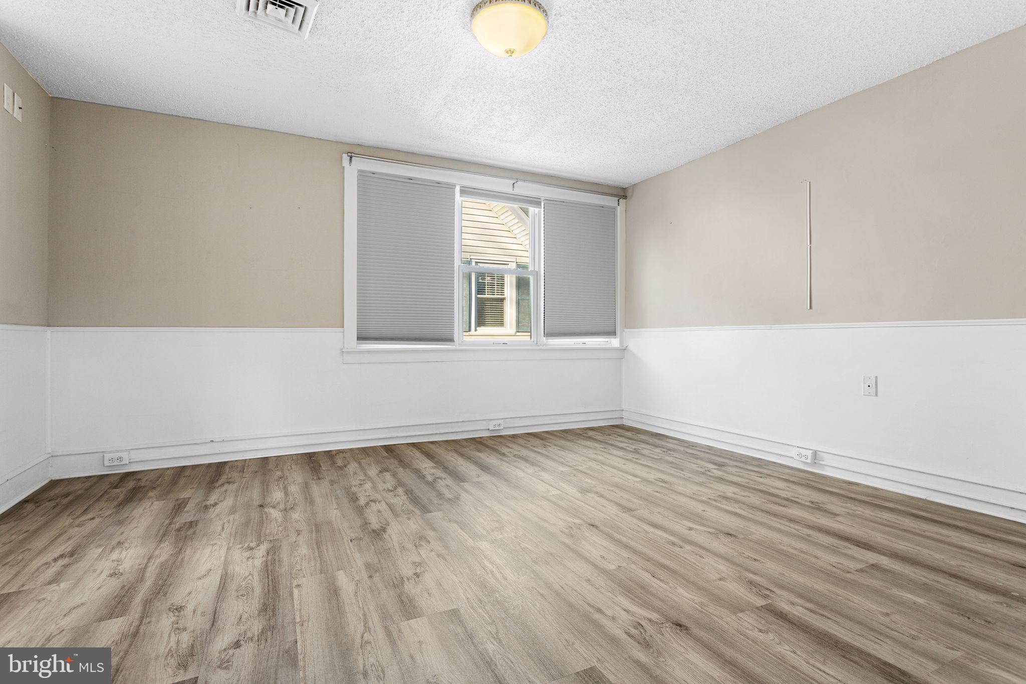 216 Richey Avenue Collingswood, NJ 08107 - Photo 20 of 39 wooden floor in an empty room with a window