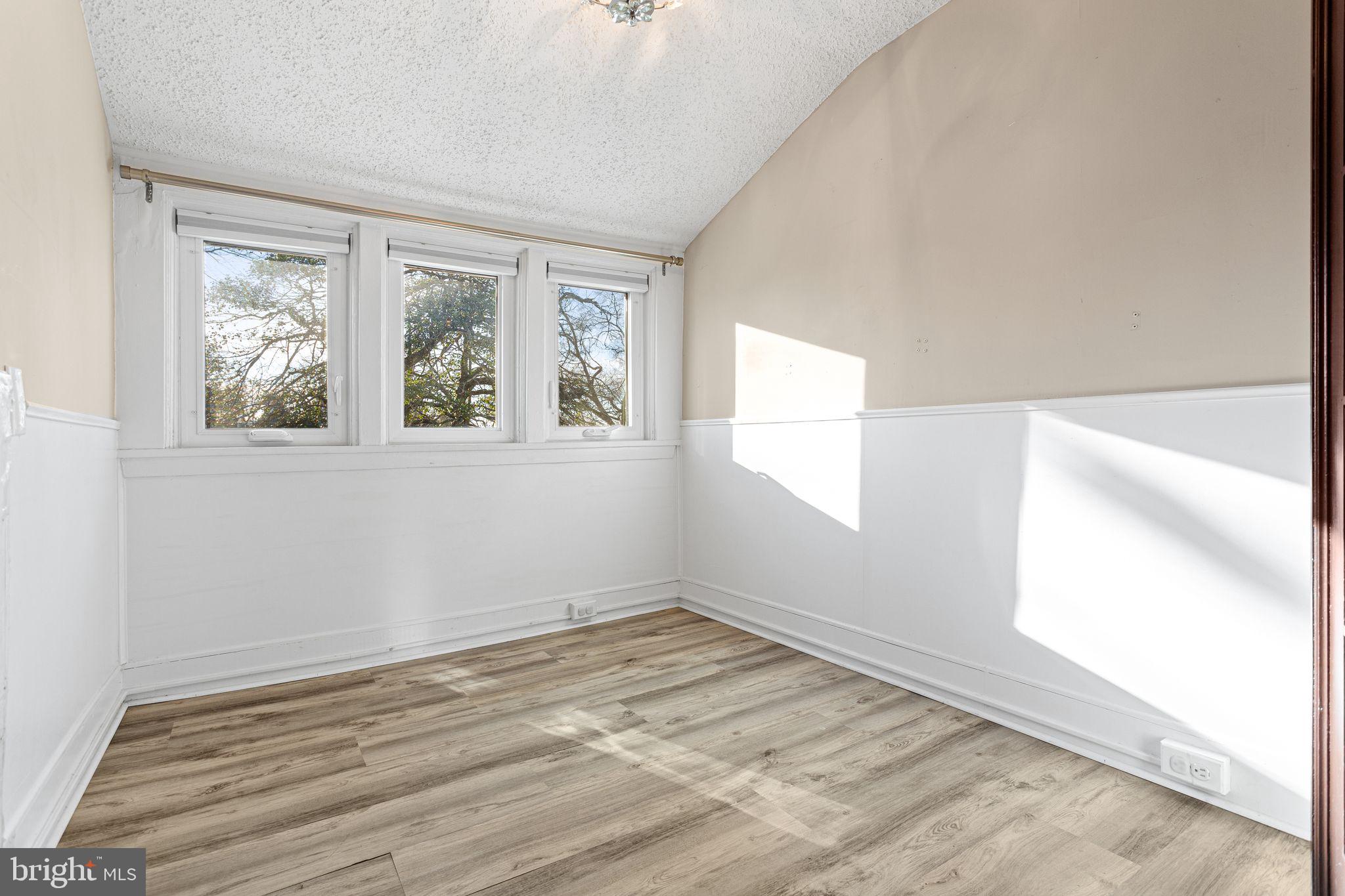 216 Richey Avenue Collingswood, NJ 08107 - Photo 22 of 39 an empty room with wooden floor and windows