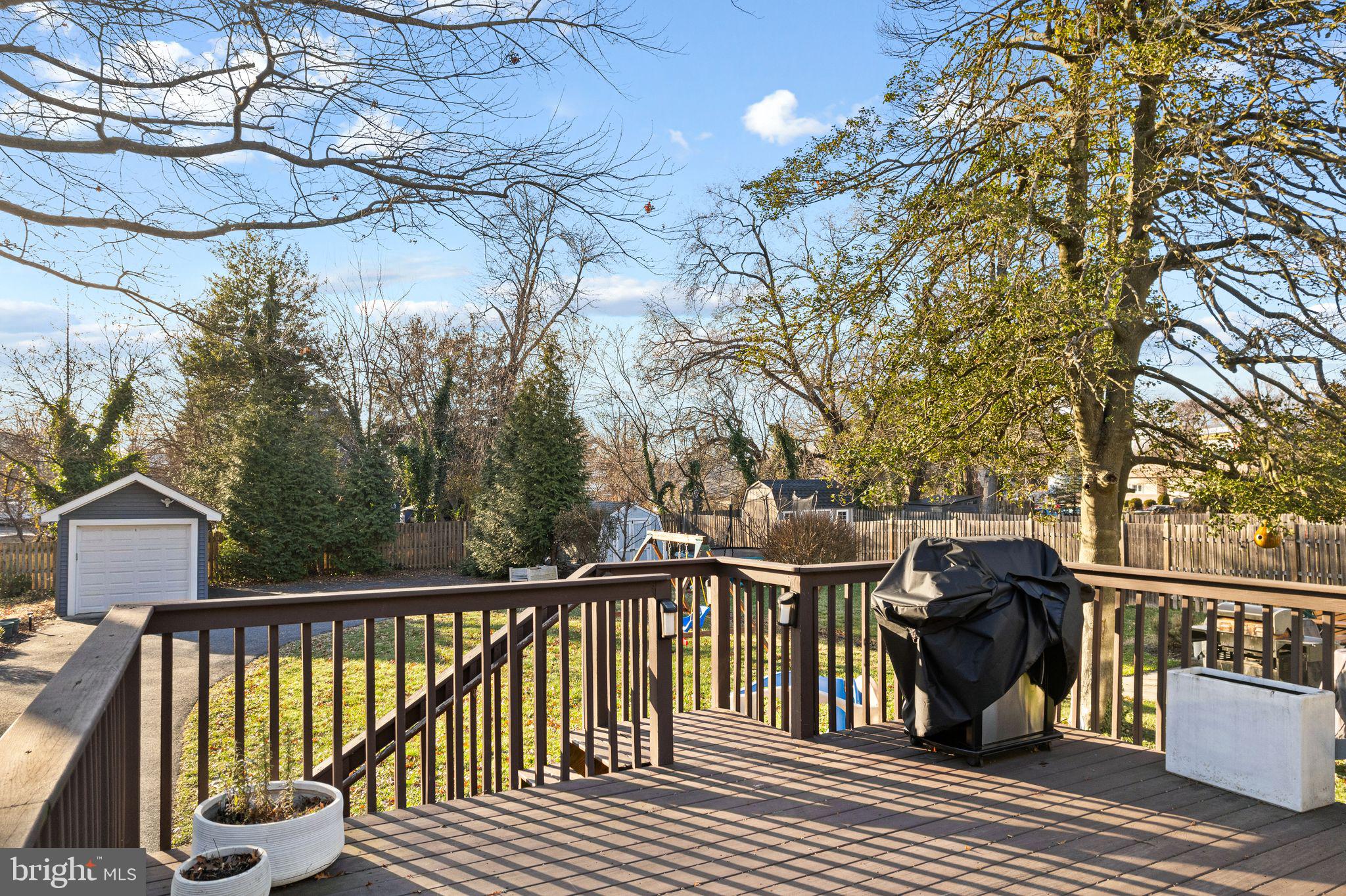 216 Richey Avenue Collingswood, NJ 08107 - Photo 28 of 39 a view of a wooden deck with trees
