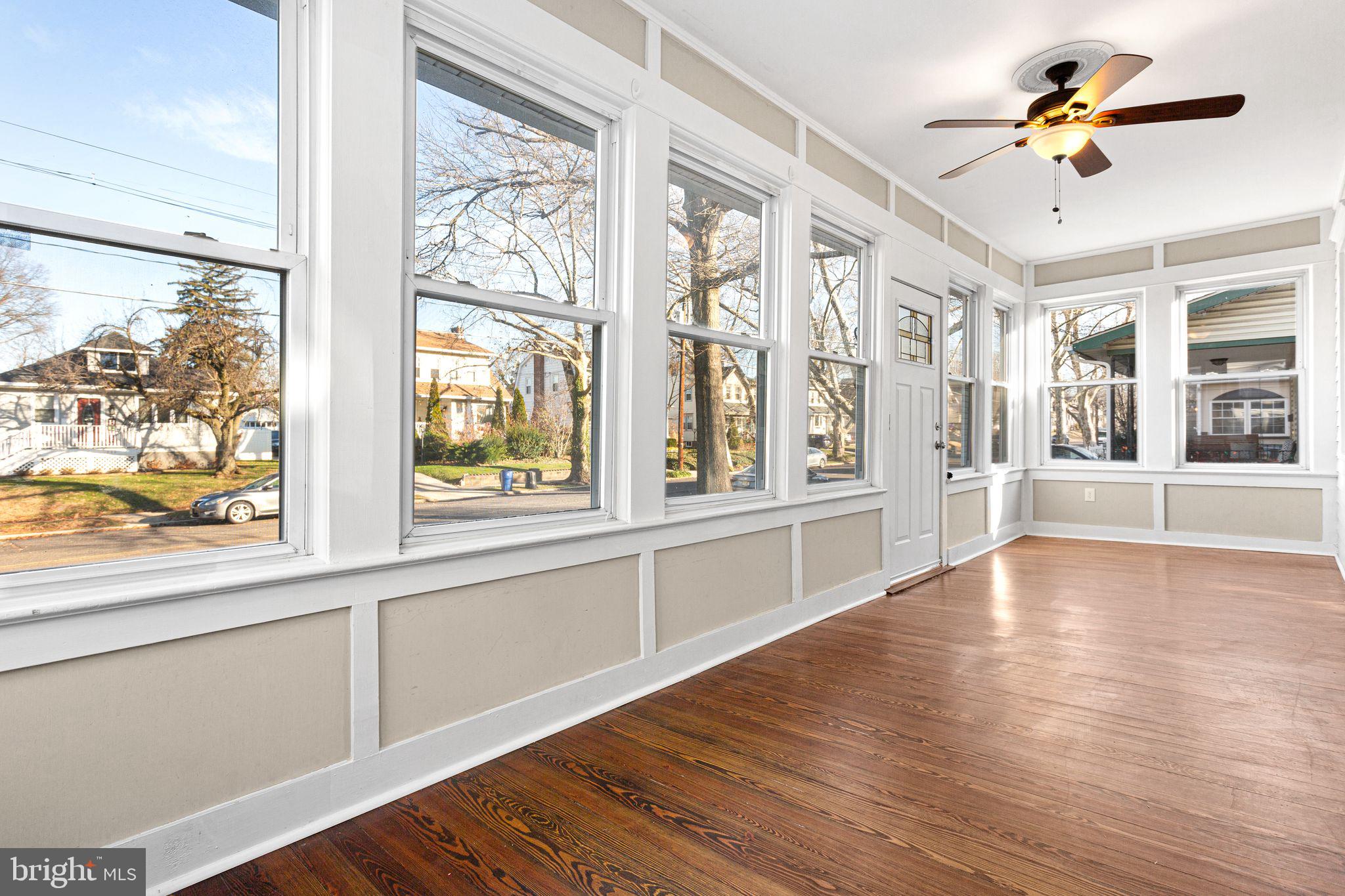 216 Richey Avenue Collingswood, NJ 08107 - Photo 3 of 39 a view of an entryway with wooden floor and a window