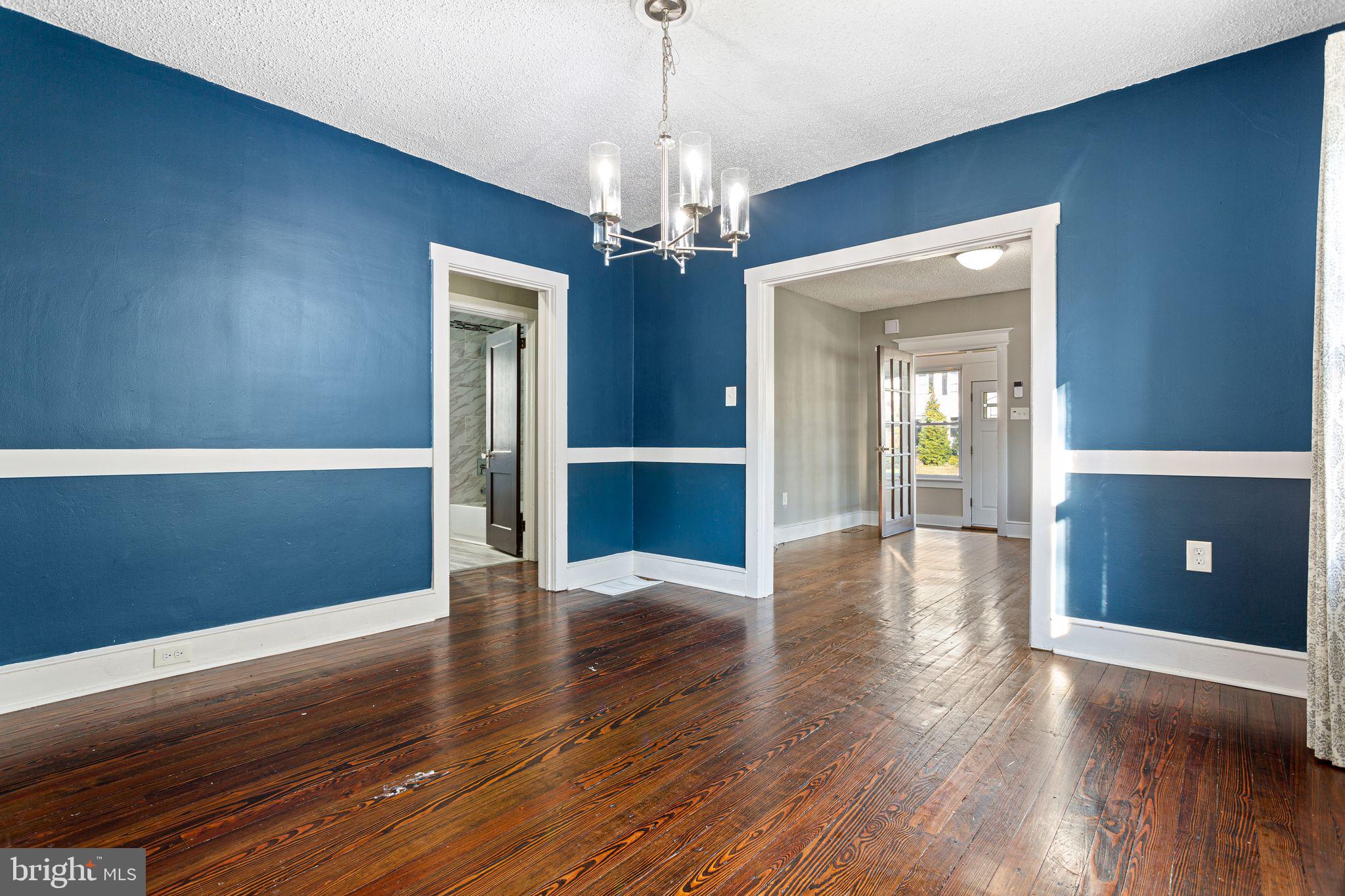 216 Richey Avenue Collingswood, NJ 08107 - Photo 7 of 39 a view of an empty room with wooden floor and stairs