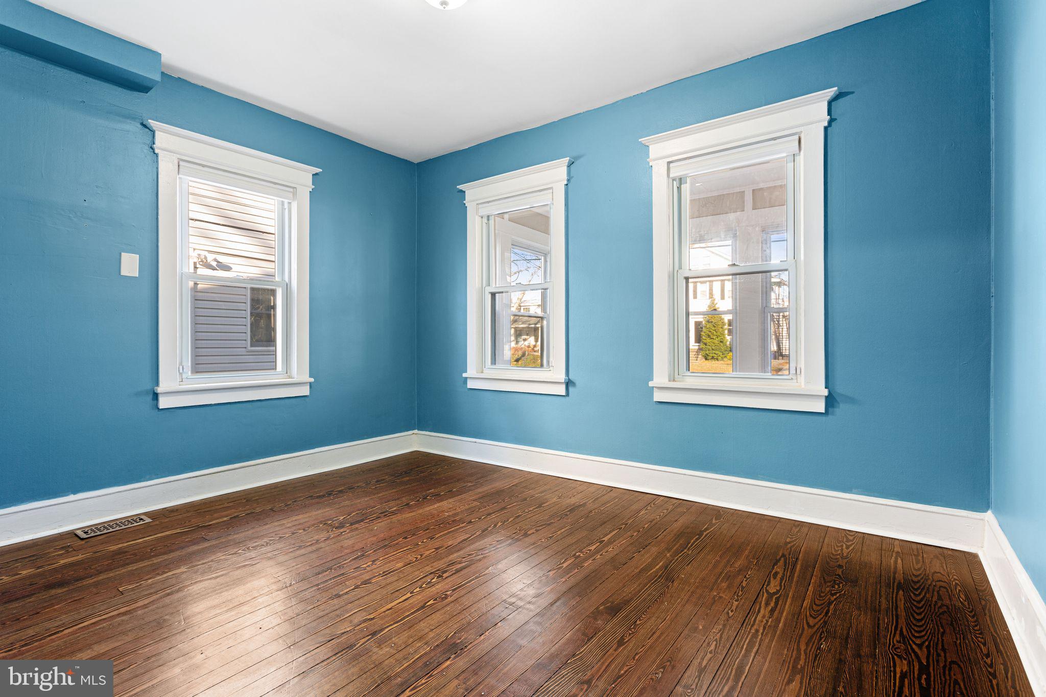 216 Richey Avenue Collingswood, NJ 08107 - Photo 10 of 39 a view of a room with wooden floor and windows