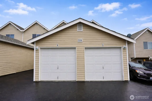 a front view of a house with a garage