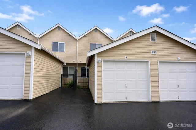 a front view of a house with garage