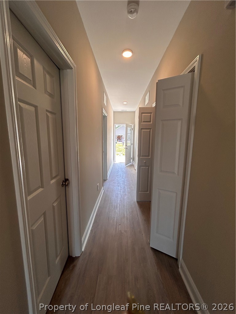 307 Elizabeth Street Spring Lake, NC 28390 - Photo 5 of 12 a view of hallway with wooden floor