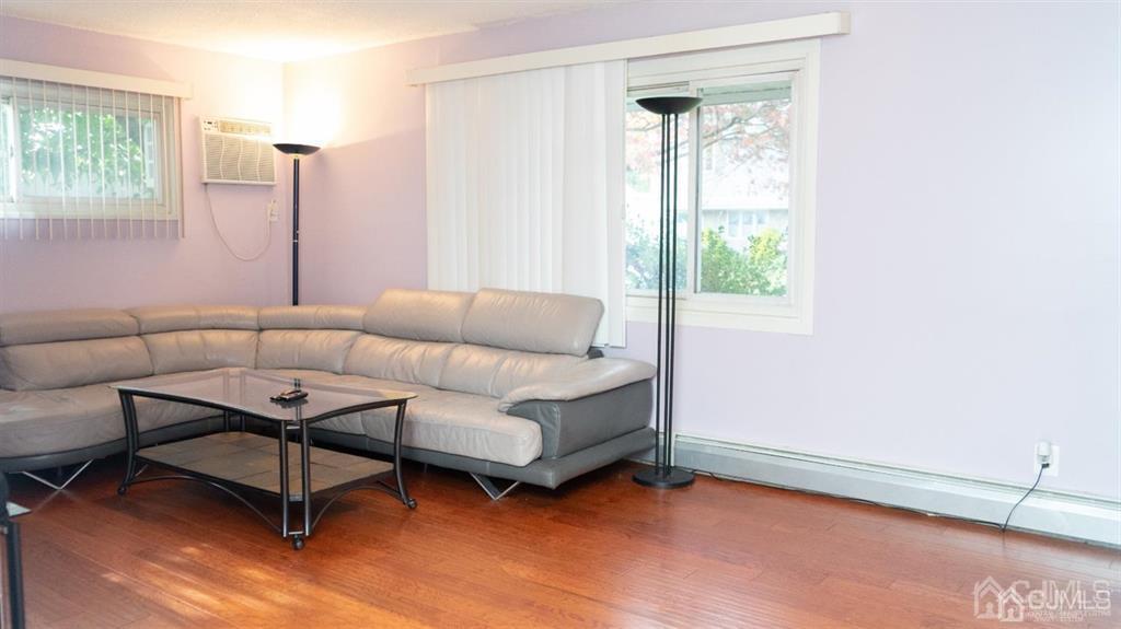 14 Winthrop Road Edison, NJ 08817 - Photo 8 of 28 a living room with furniture and a window