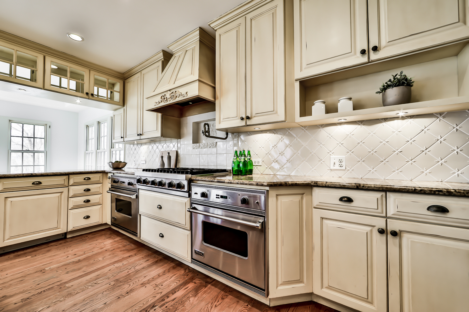 144 Michaux Road Riverside, IL 60546 - Photo 14 of 41 a kitchen with stainless steel appliances granite countertop a stove and white cabinets