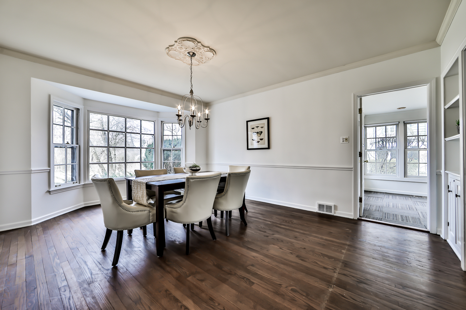 144 Michaux Road Riverside, IL 60546 - Photo 8 of 41 a view of a dining room with furniture window and wooden floor