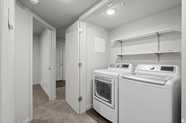 64 West 600 South, Unit C205 Springville, UT 84663 - Photo 18 of 28 Washroom with dark carpet and separate washer and dryer