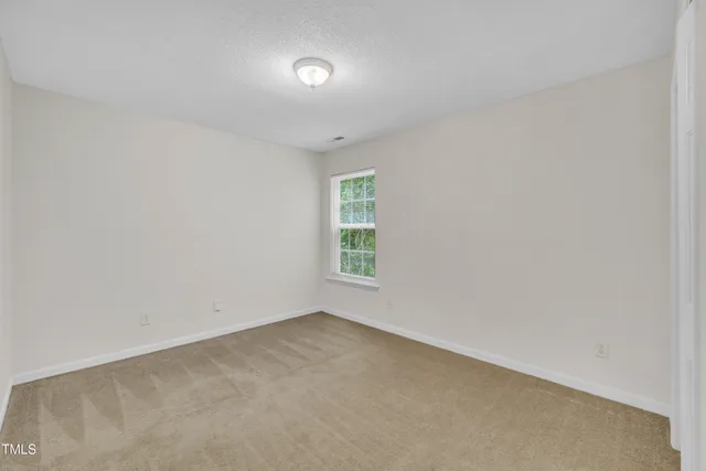 a bathroom with a shower and a toilet