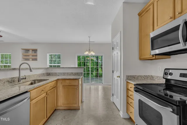 an aerial view of a house with mountain view