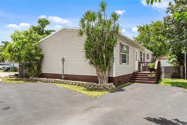 a house with trees in front of it
