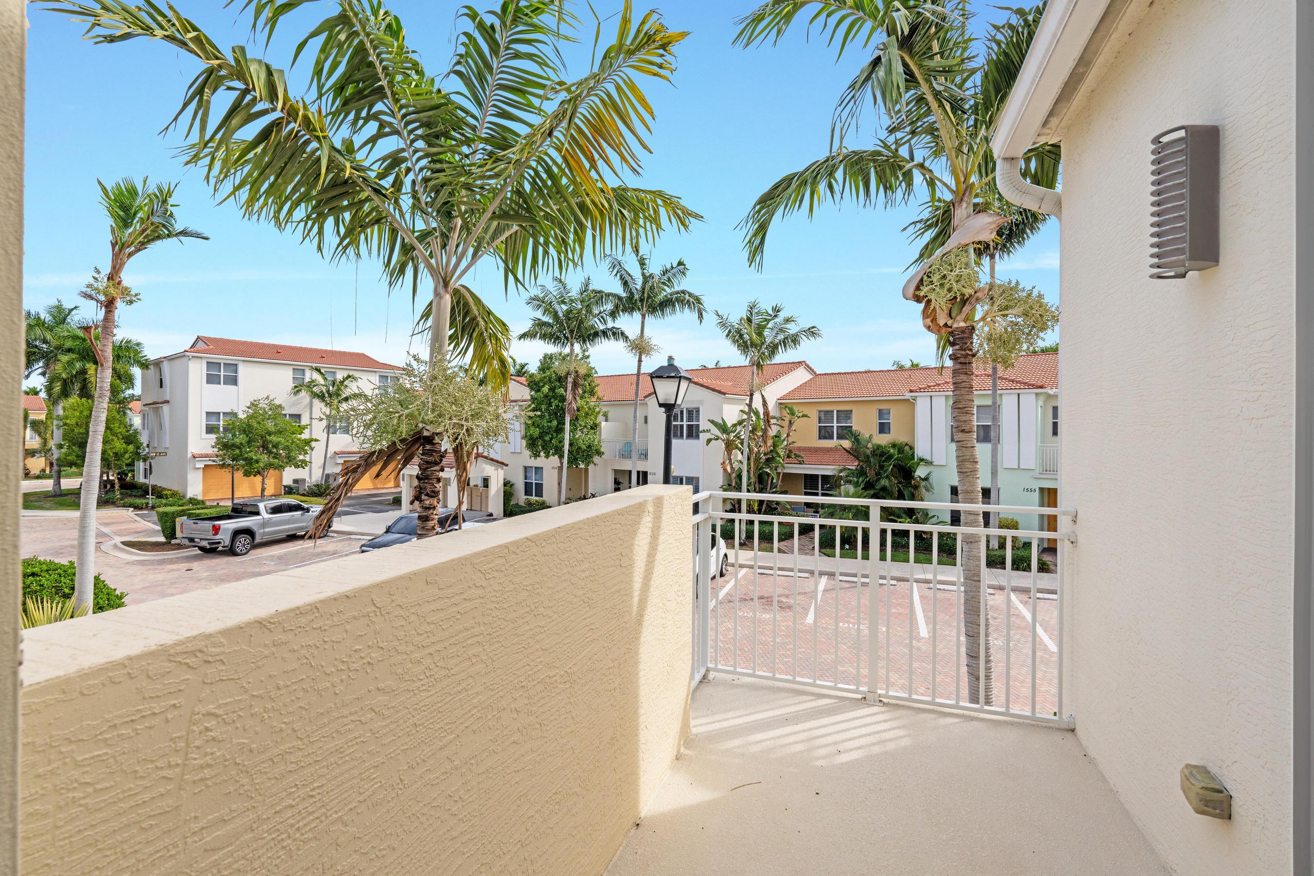 5010 Northwest 16th Way Boca Raton, FL 33431 - Photo 13 of 42 a view of a backyard with a patio and swimming pool