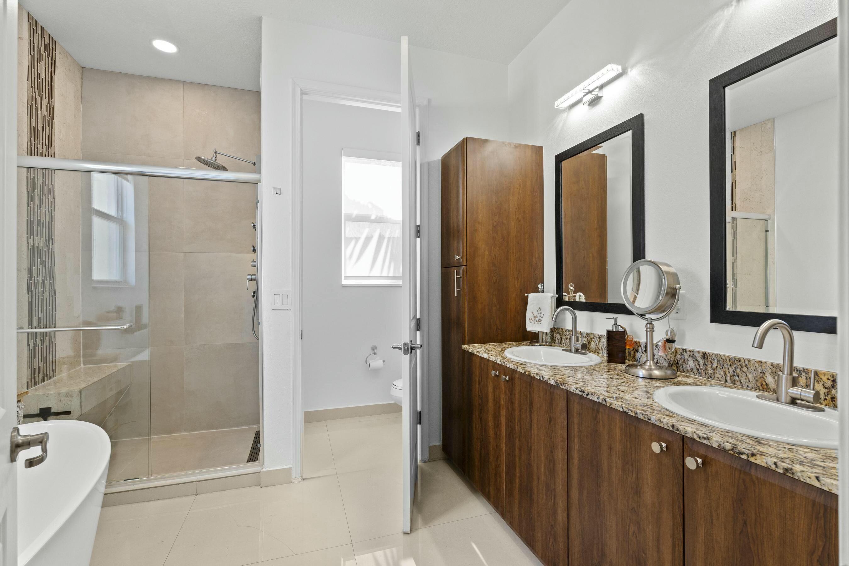 5010 Northwest 16th Way Boca Raton, FL 33431 - Photo 15 of 42 a bathroom with a granite countertop sink mirror and double