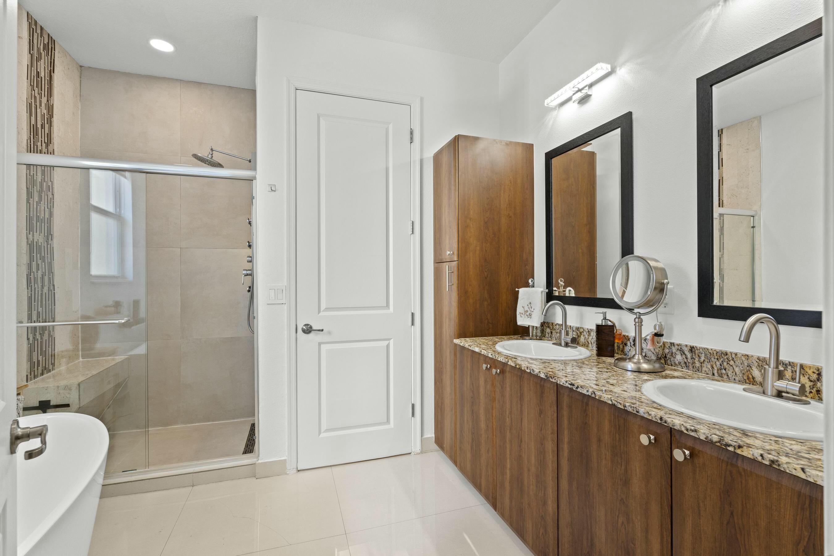 5010 Northwest 16th Way Boca Raton, FL 33431 - Photo 16 of 42 a bathroom with a granite countertop sink mirror and double