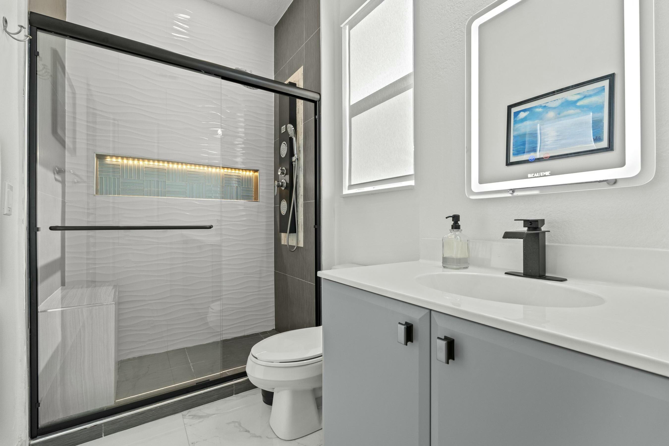 5010 Northwest 16th Way Boca Raton, FL 33431 - Photo 21 of 42 a bathroom with a sink a toilet and shower