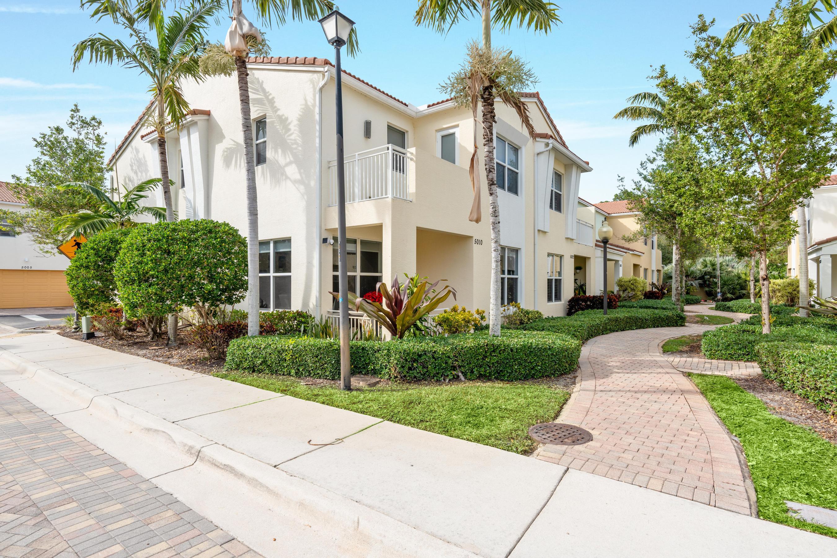 5010 Northwest 16th Way Boca Raton, FL 33431 - Photo 30 of 42 a front view of a residential houses with yard and green space