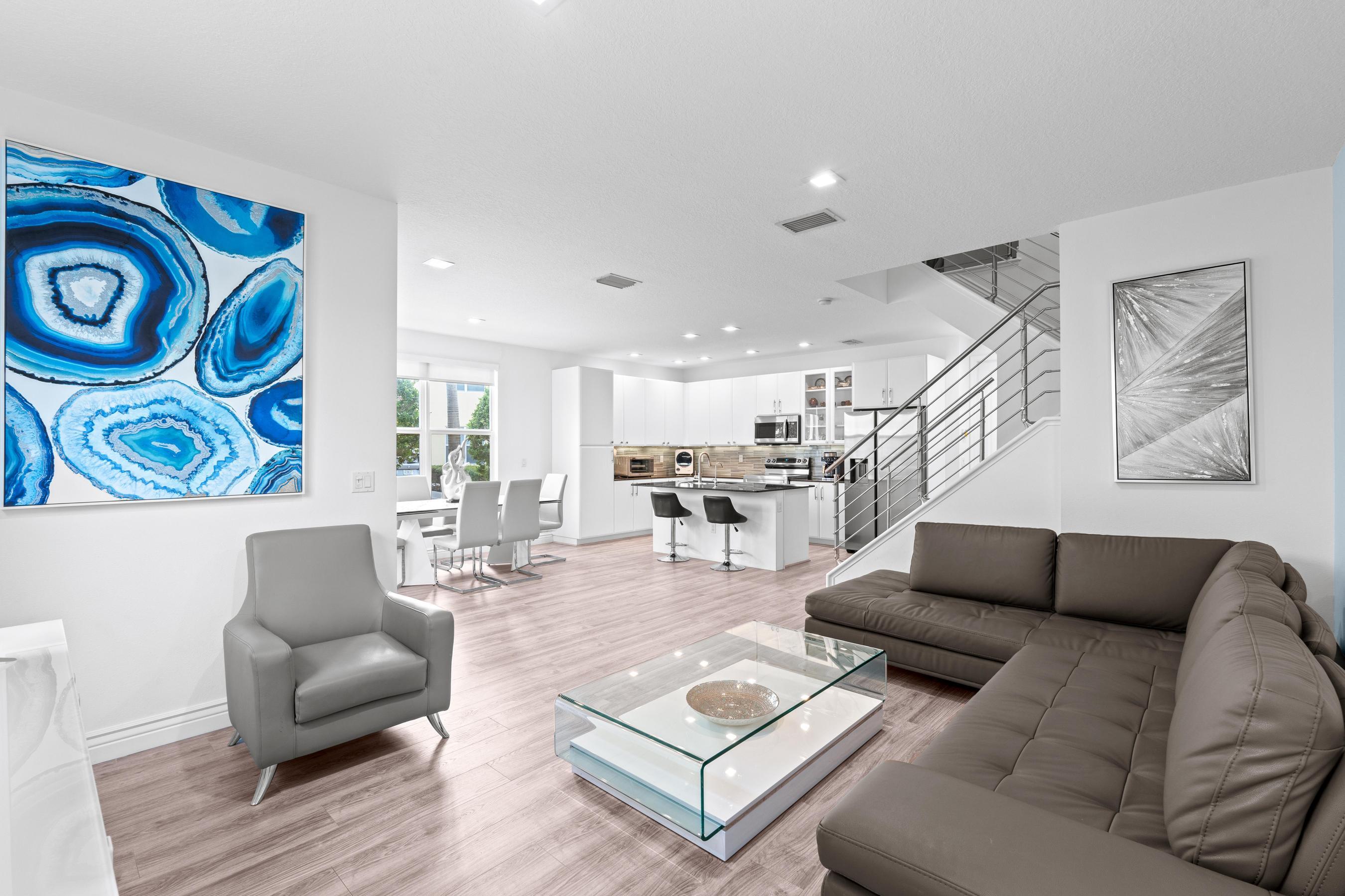 5010 Northwest 16th Way Boca Raton, FL 33431 - Photo 3 of 42 a living room with furniture and wooden floor